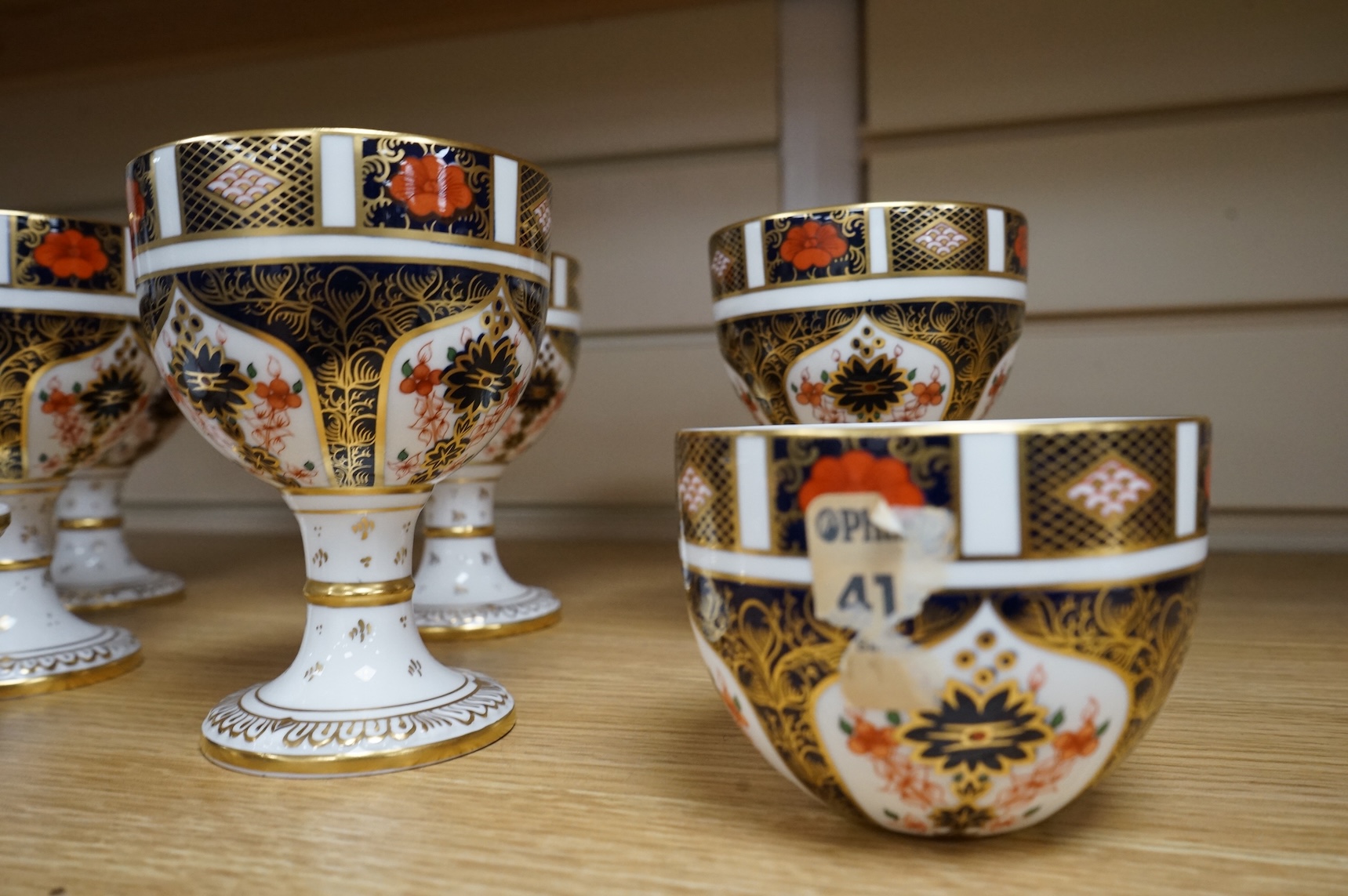 A group of six Royal Crown Derby stemmed cups (one cup and stem detached). 12.5cm high